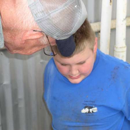 Volunteers clean up Kiddie Park to prepare it for opening weekend.