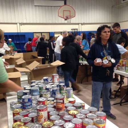 Volunteers waiting to fill their boxes.