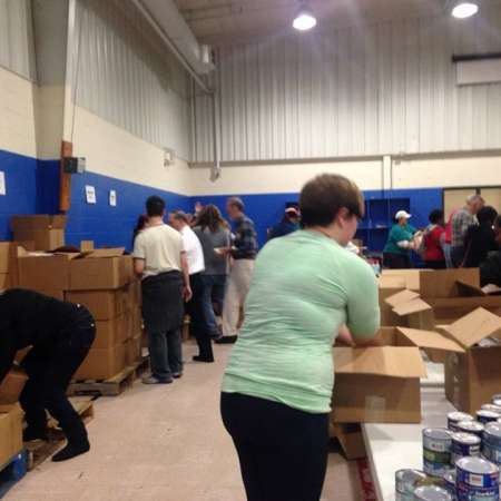 Volunteers waiting to fill their boxes.