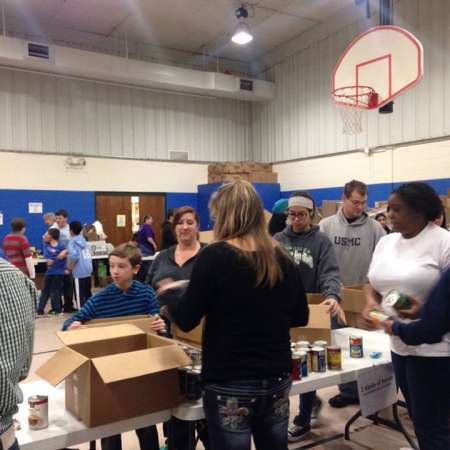 Volunteers waiting to fill their boxes.