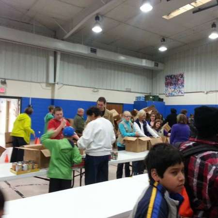 Volunteers wait to pack their boxes.