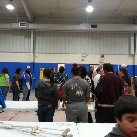 Volunteers wait to pack their boxes.