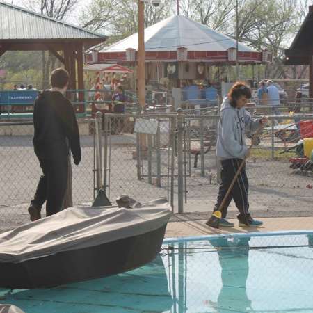 Volunteers clean up Kiddie Park for opening weekend.