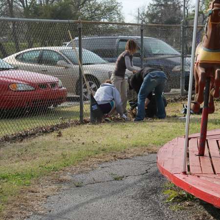 Volunteers clean up Kiddie Park for opening weekend.