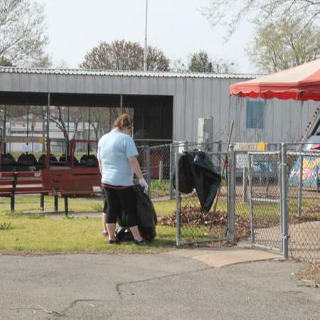 Volunteers clean up Kiddie Park for opening weekend.