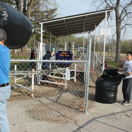 Volunteers clean up Kiddie Park for opening weekend.