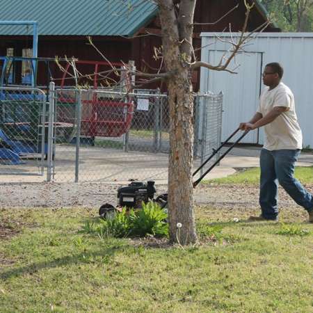 Volunteers clean up Kiddie Park for opening weekend.