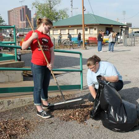 Volunteers clean up Kiddie Park for opening weekend.