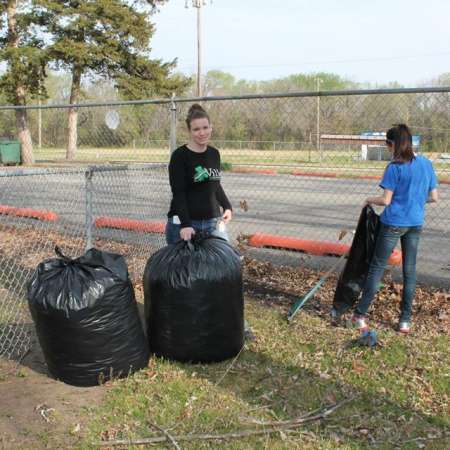 Volunteers clean up Kiddie Park for opening weekend.