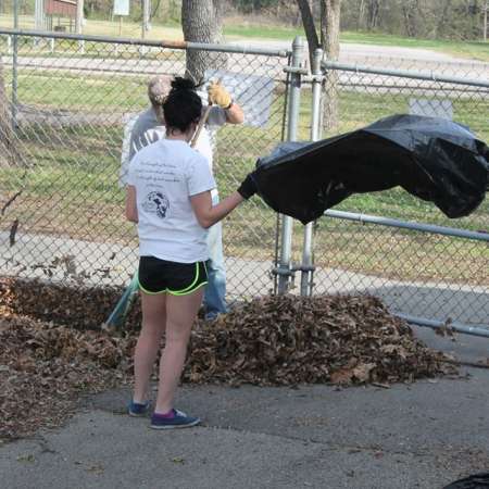 Volunteers clean up Kiddie Park for opening weekend.