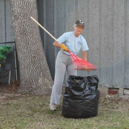 Volunteers clean up Kiddie Park for opening weekend.