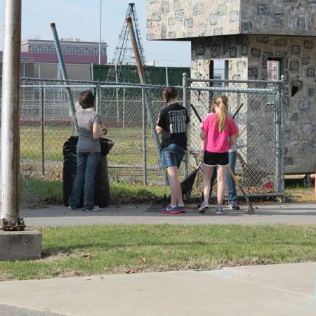 Volunteers clean up Kiddie Park for opening weekend.