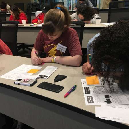 Students practice taking notes.