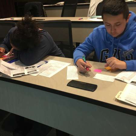 Students practice taking notes.