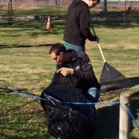 Students, parents, and mentors help to clean up Kiddie Park.