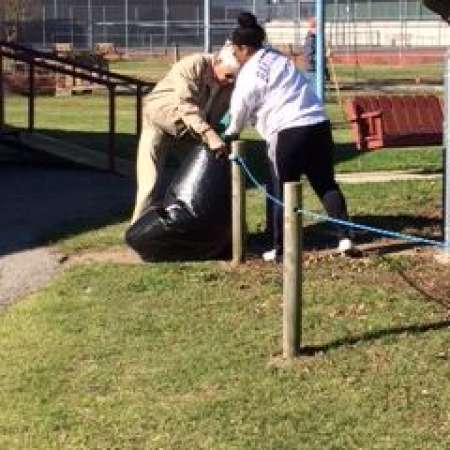 Students, parents, and mentors help to clean up Kiddie Park.