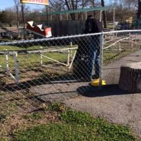 Students, parents, and mentors help to clean up Kiddie Park.