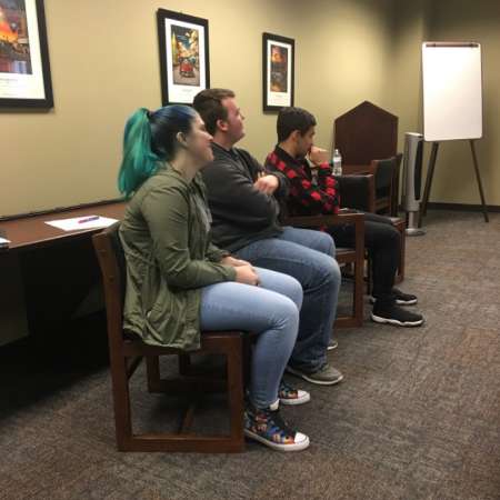 Students listen to classmates presentations.