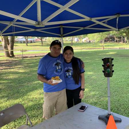 Guadalupe and her father volunteer at SunFest.