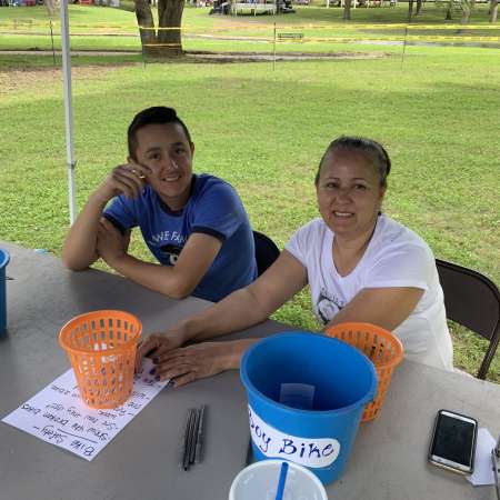 Jonathan and his mother volunteer at SunFest.