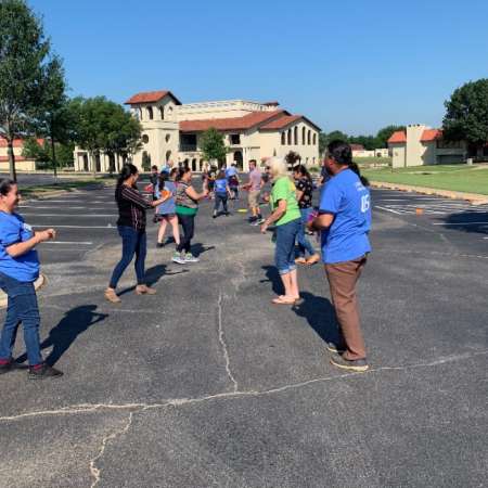 Outside relay activity for physical activity theme.