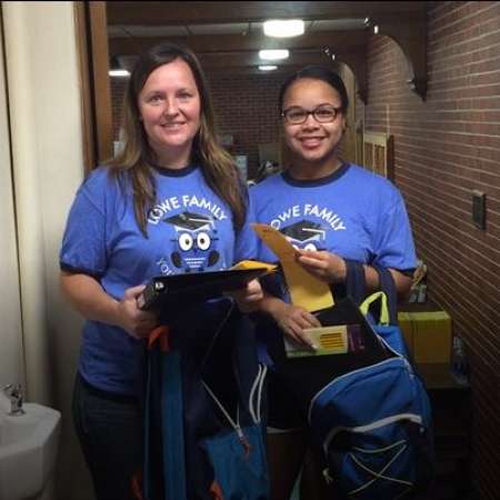 Students volunteer to help fill backpacks.