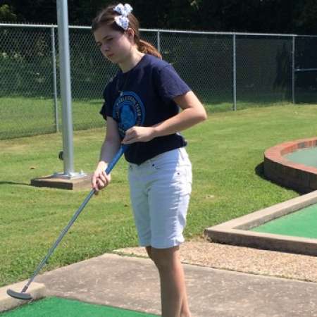 Christina gauges her putting shot.