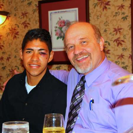 Josue and his mentor Mike at the Senior Luncheon after his soccer match.