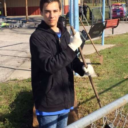 Students, parents, and mentors clean up Kiddie Park before opening.