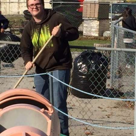 Students, parents, and mentors clean up Kiddie Park before opening.