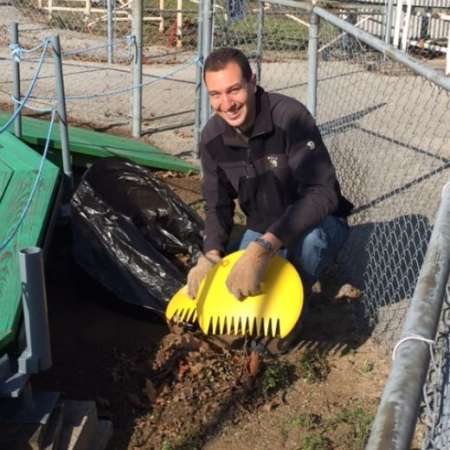 Students, parents, and mentors clean up Kiddie Park before opening.