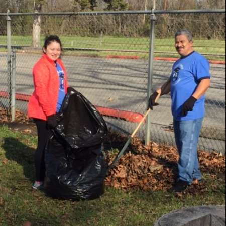 Students, parents, and mentors clean up Kiddie Park before opening.