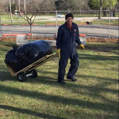 Students, parents, and mentors clean up Kiddie Park before opening.