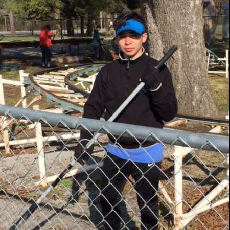 Students, parents, and mentors clean up Kiddie Park before opening.