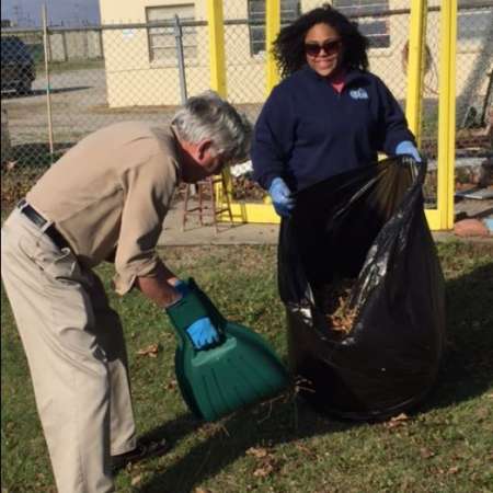 Students, parents, and mentors clean up Kiddie Park before opening.