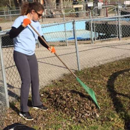 Students, parents, and mentors clean up Kiddie Park before opening.