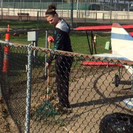 Students, parents, and mentors clean up Kiddie Park before opening.