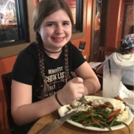 Christina enjoys dinner after calligraphy class with mentor using mini grant.