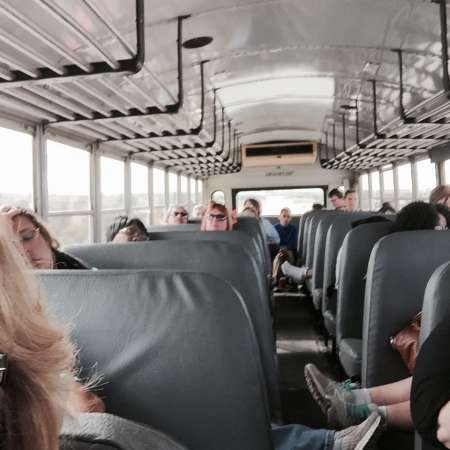 Students relax on the way home from OSU Tour.